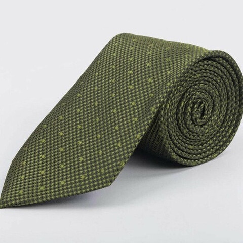 Аренда зеленого галстука с узором для мужского костюма