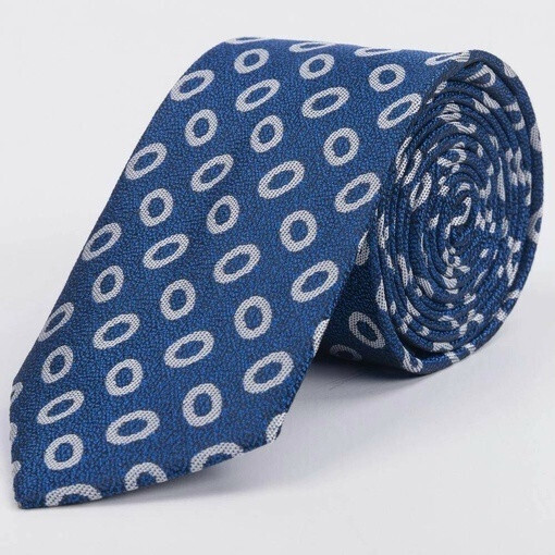 Прокат текстурированного галстука синего цвета с крупным белым кольцевым узором для мужских костюмов